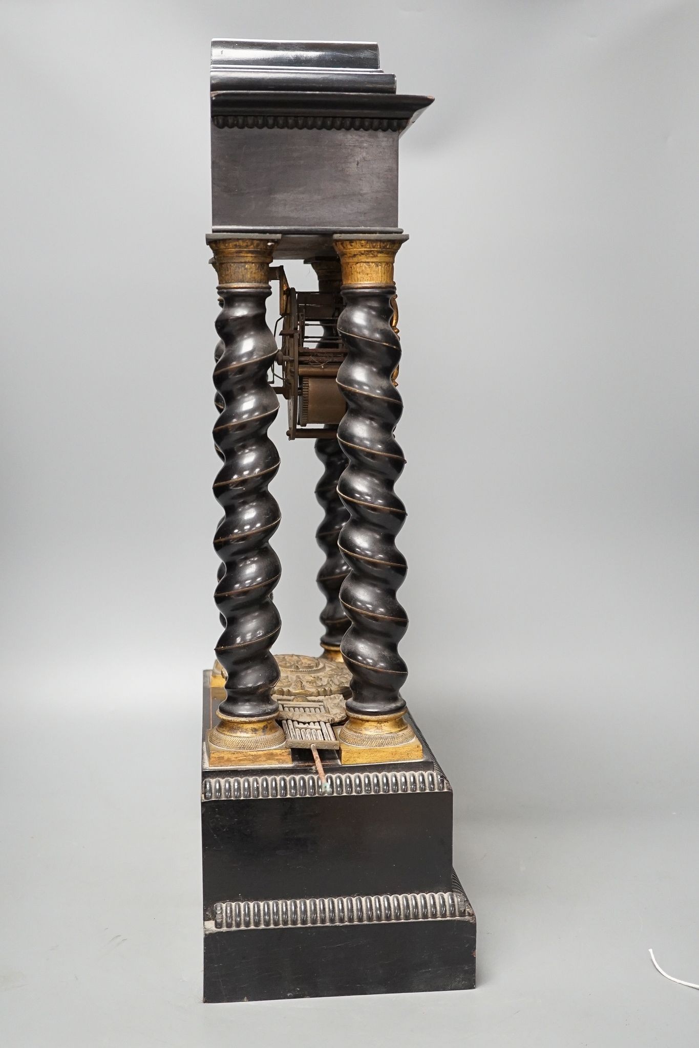 An ebonised and marquetry portico clock, dial signed Valogne, Paris, 56cm high